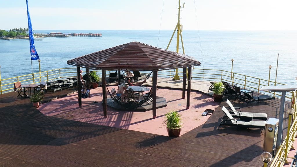 Sun deck with mabul in the background at on the rig diving mabul sabah malaysia