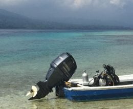 Dive munda smaller boat at lunch break island munda diving solomon islands