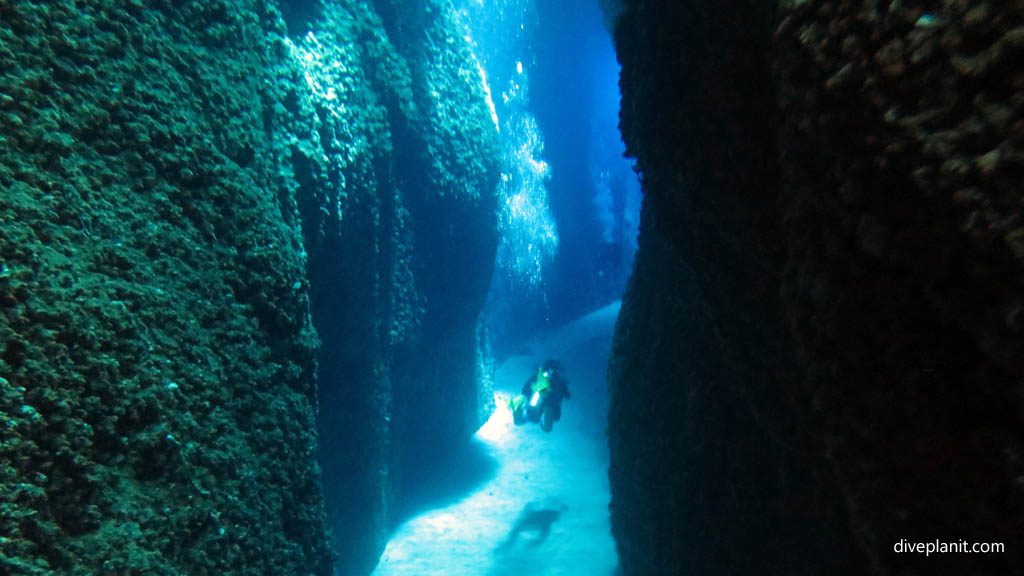 Exiting the cut diving Leru Cut at Russell Islands Solomon Islands by Diveplanit