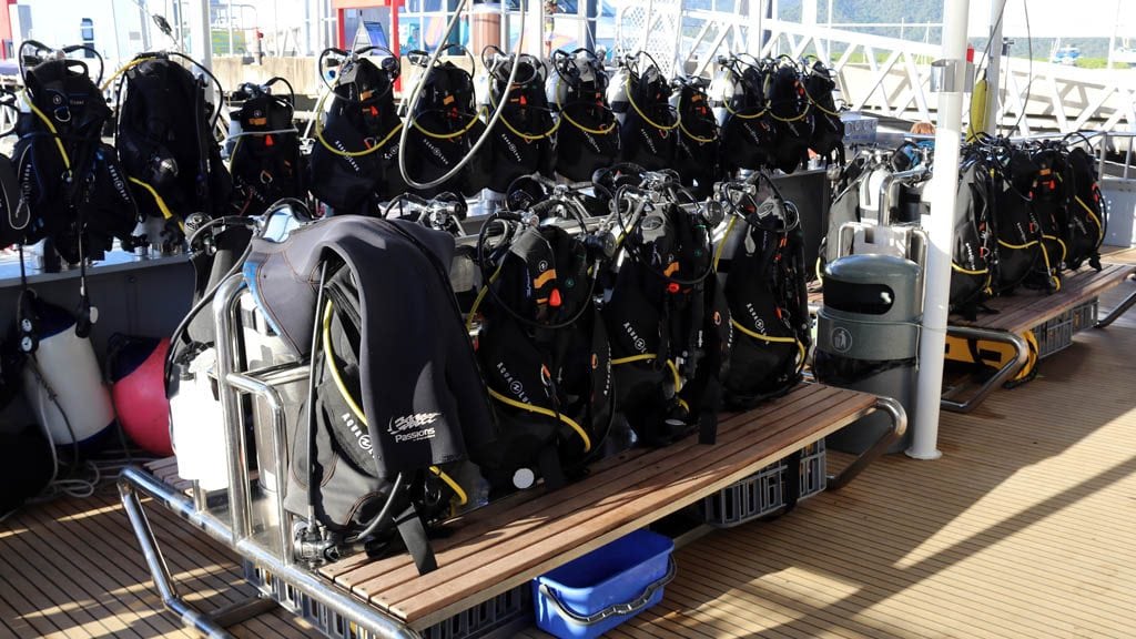 Dive deck with rows of new gear at passions of paradise diving hastings reef great barrier reef queensland diveplanit