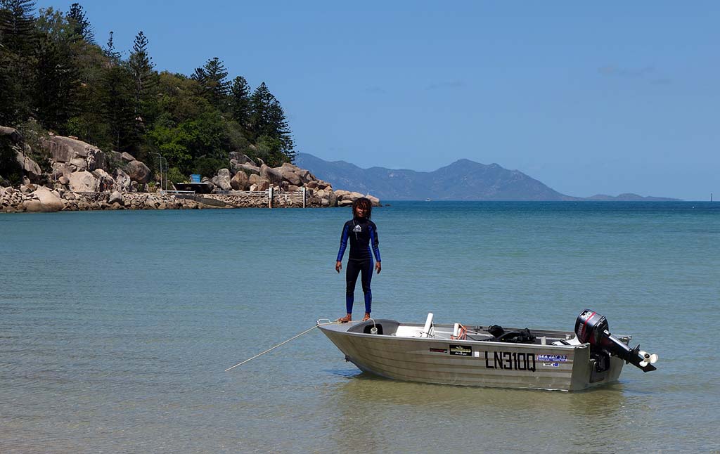 Loading dive gear on Magnetic Island Papua New Guinea marine conservation