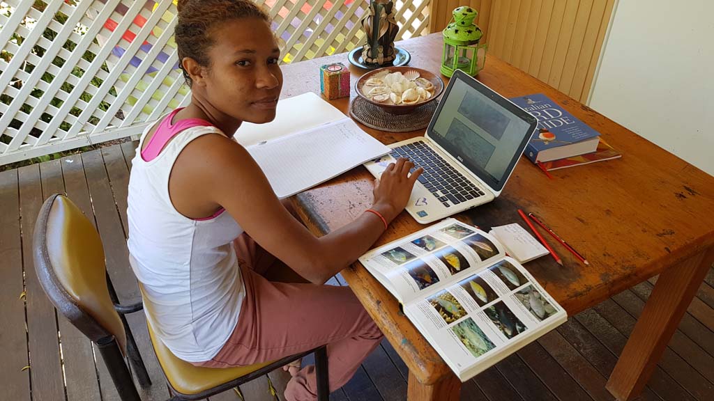 Lorie studying reef fish ID at Magnetic Island Papua New Guinea marine conservation