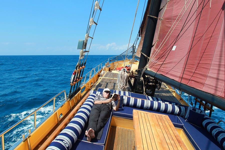 Adelaar liveaboard cruising and diving bali to komodo indonesia lazing on deck