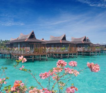 Mabul Water Bungalows comprises 14 tastefully decorated over-water bungalows; nearby Smart Divers offers daily dives on Mabul, Kapalai and Sipadan sites