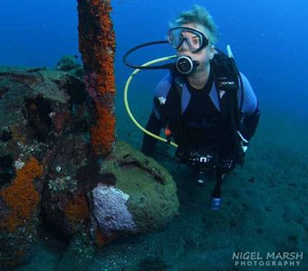 Helen Rose admiring the propellor of the Zero plane wreck at Munda Solomon Islands