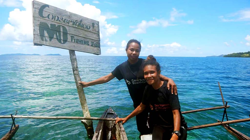Sea Women of Melanesia with No Fishing sign