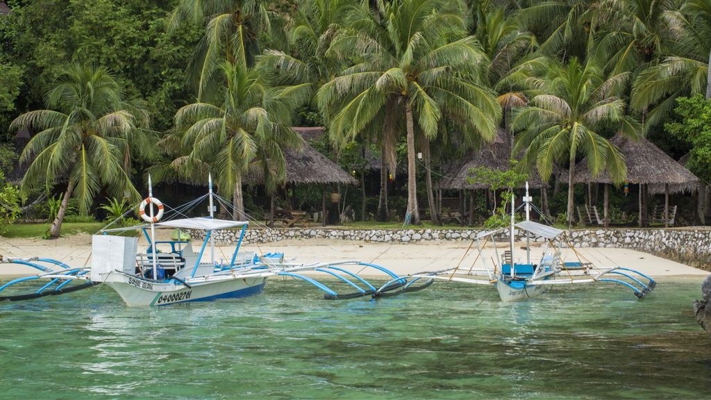 8 sangat island dive resort coron philippines beach view w boats 2