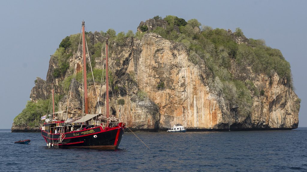 12 the junk liveaboard thailand aerial boat with island background