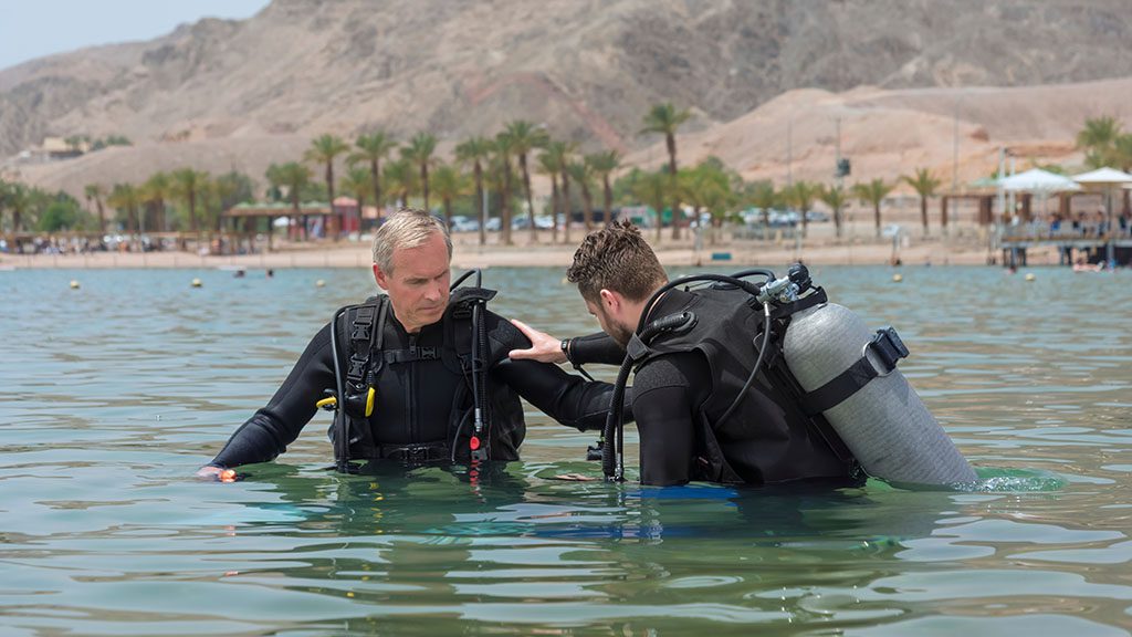 Diving and ageing diver and instructor shutterstock 1480341422 1024 Diving and ageing diver and instructor shutterstock 1480341422 1024