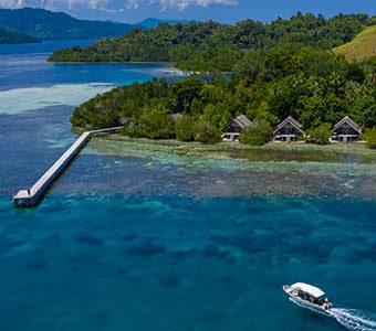 3 kusu island resort halmera indonesia aerial view with jetty feature340